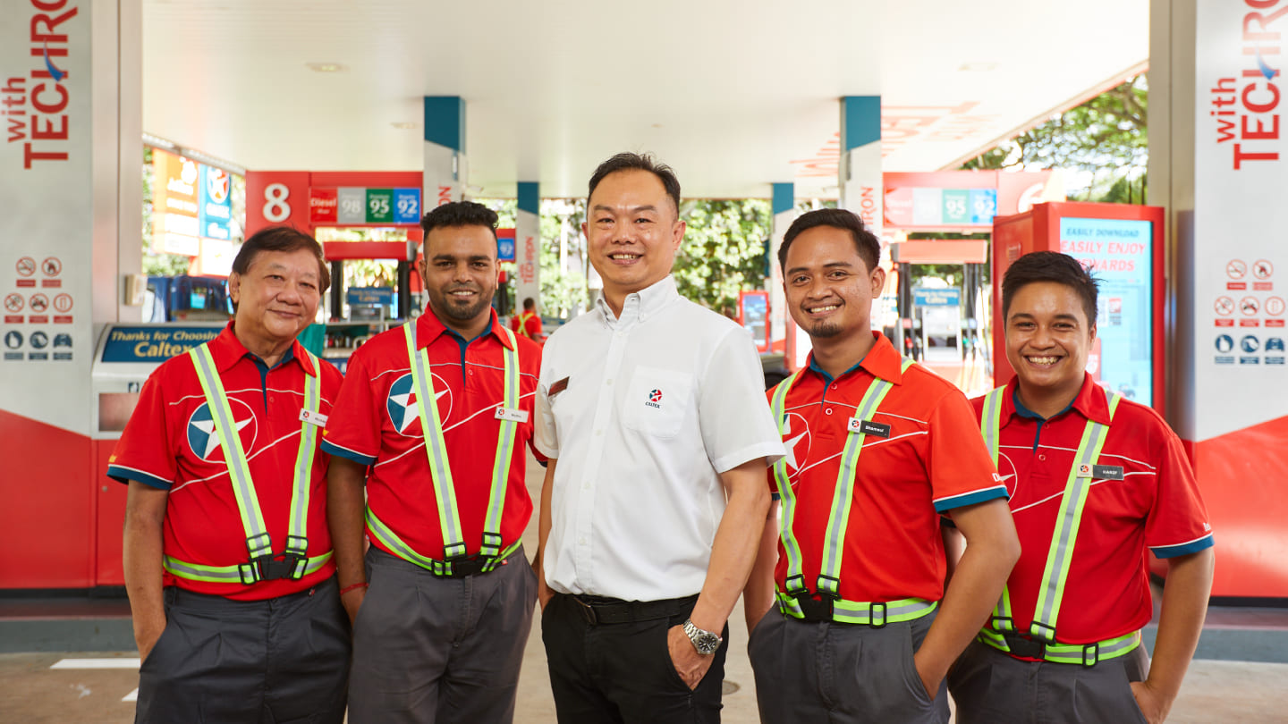 Caltex station manager with team