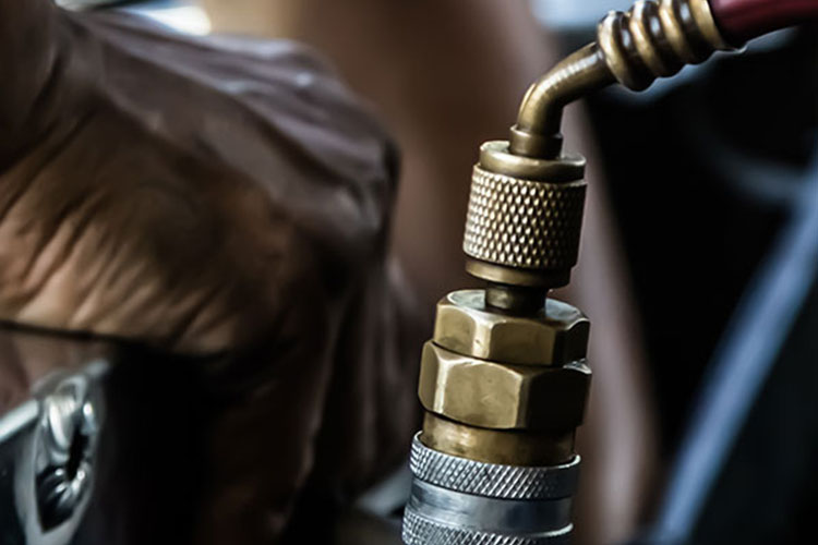 Close up of a hand fixing an engine